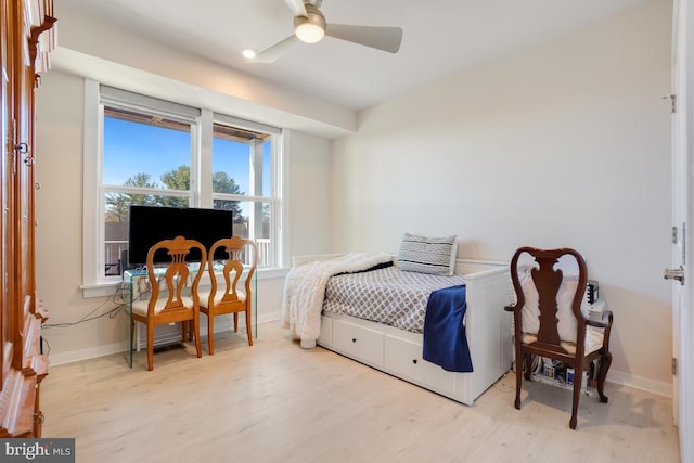 bedroom featuring light wood-type flooring and ceiling fan