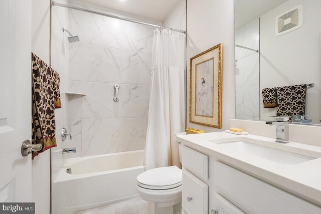 full bathroom featuring vanity, shower / bath combination with curtain, and toilet