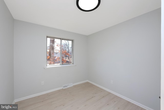 unfurnished room with light hardwood / wood-style flooring