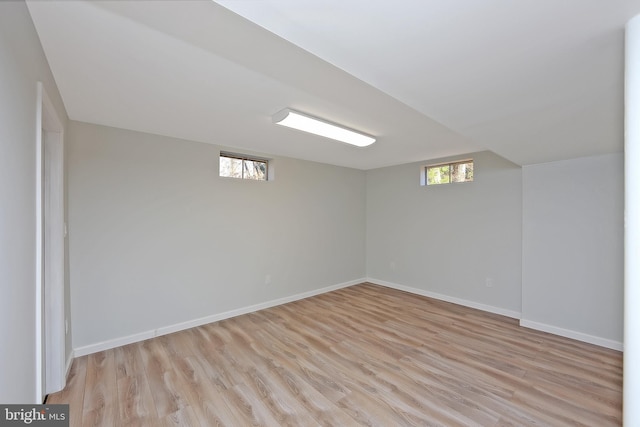 basement featuring light hardwood / wood-style flooring