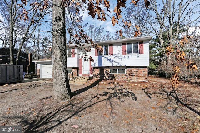 split foyer home featuring a garage