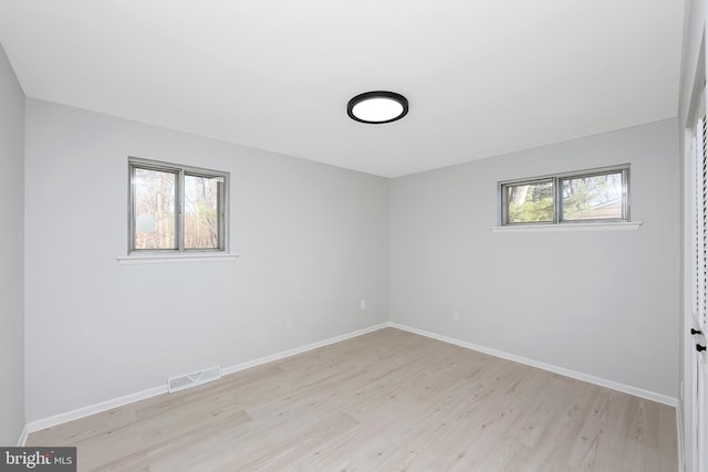 spare room with light hardwood / wood-style floors