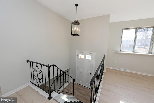 staircase featuring wood-type flooring