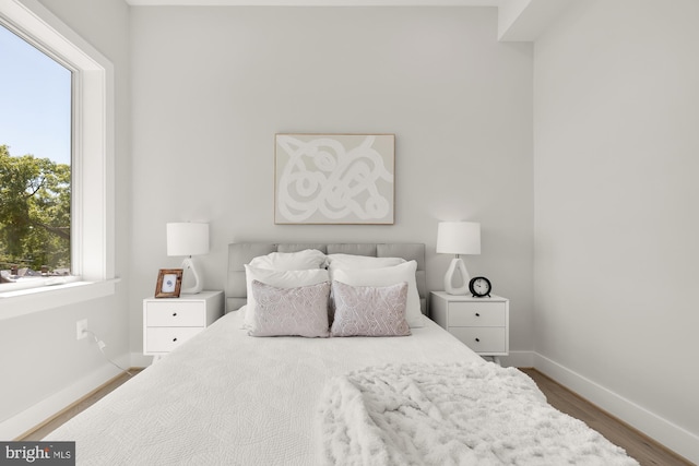 bedroom featuring wood-type flooring