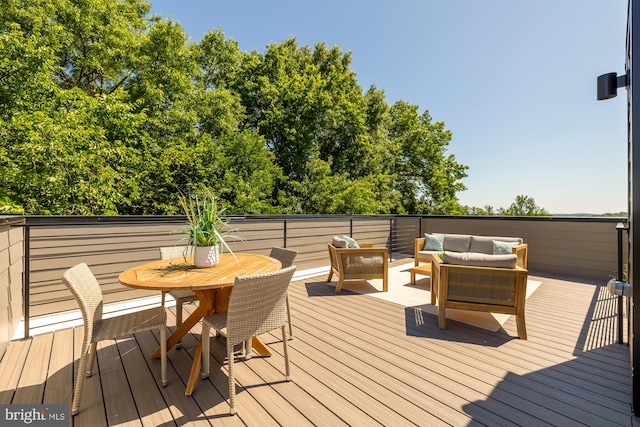 wooden terrace featuring outdoor lounge area