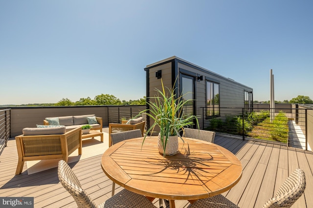 wooden terrace with outdoor lounge area