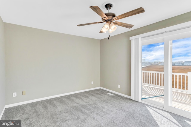 carpeted empty room with ceiling fan