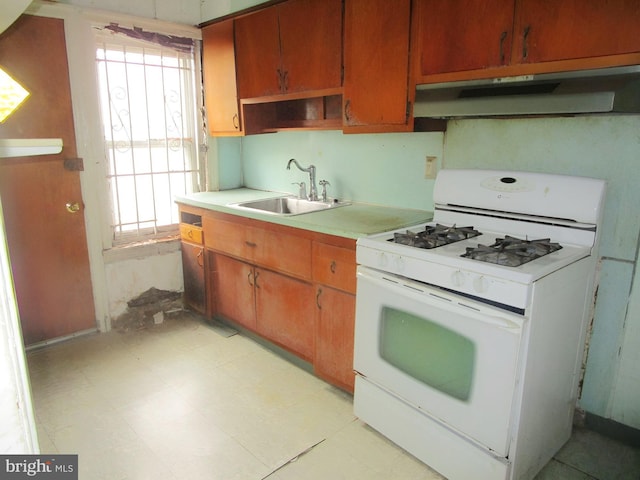 kitchen with gas range gas stove and sink