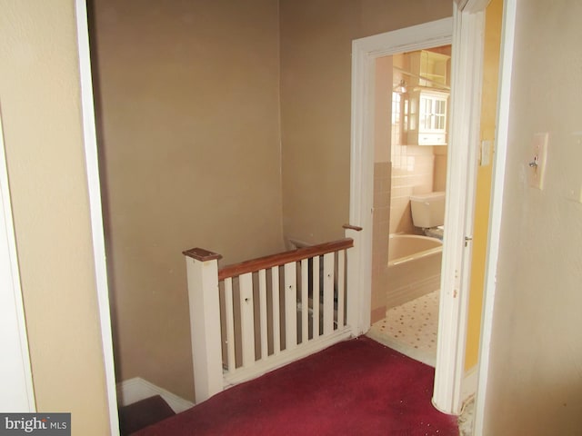 staircase with tile walls