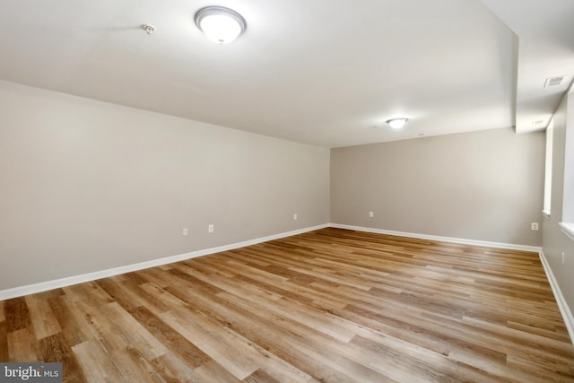 spare room featuring light hardwood / wood-style flooring