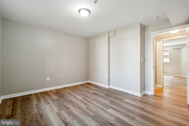 spare room with light hardwood / wood-style floors