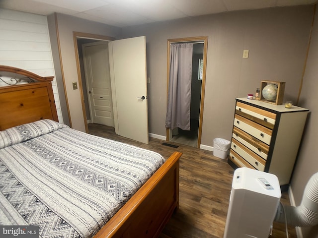 bedroom featuring dark wood-type flooring