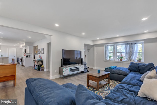 living room with light hardwood / wood-style flooring