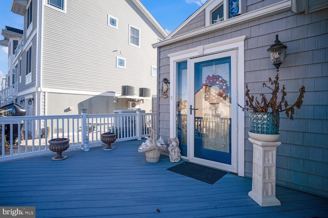 doorway to property with central AC unit