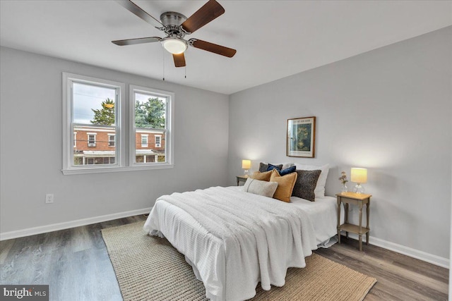 bedroom featuring ceiling fan and hardwood / wood-style flooring