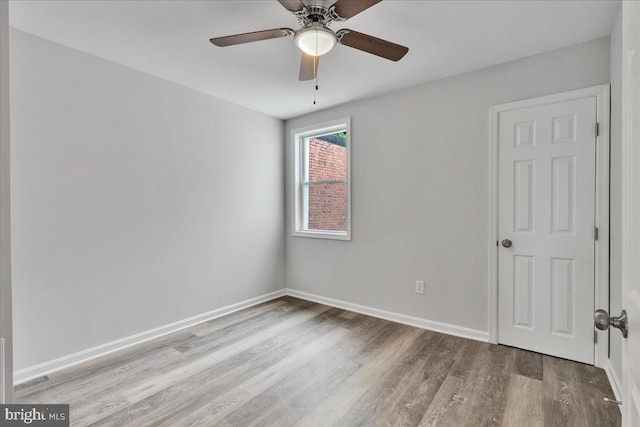 empty room featuring light hardwood / wood-style floors and ceiling fan