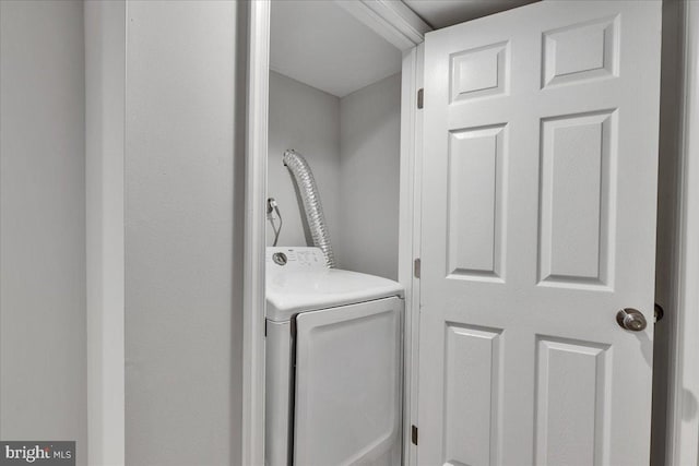 clothes washing area featuring washer / clothes dryer