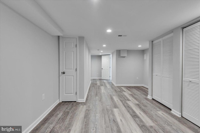 basement featuring light hardwood / wood-style flooring