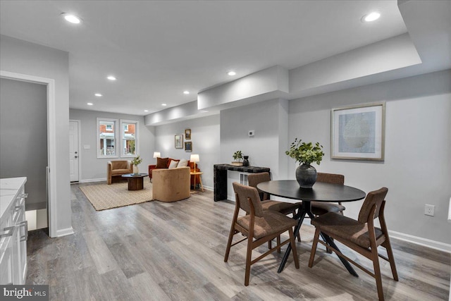 dining space featuring light hardwood / wood-style flooring