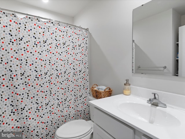 bathroom with vanity and toilet