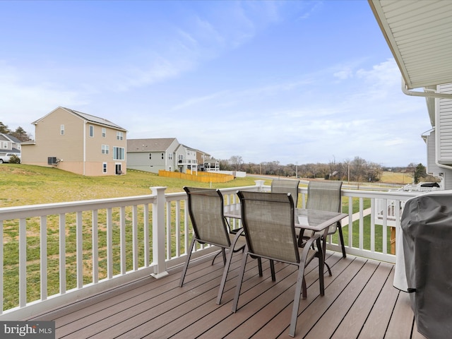 wooden deck featuring a yard