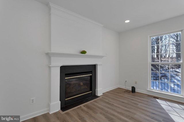 unfurnished living room featuring hardwood / wood-style floors