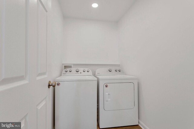 clothes washing area with independent washer and dryer