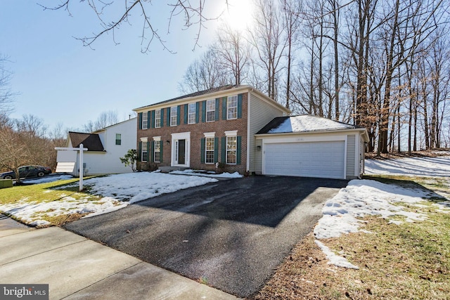 colonial inspired home featuring a garage