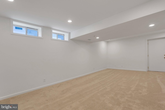 basement with light colored carpet