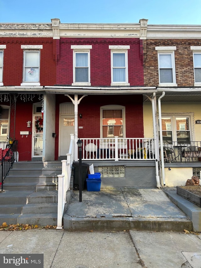 view of property with a porch