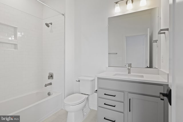 full bathroom with tile patterned flooring, vanity, toilet, and tiled shower / bath combo