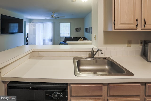 kitchen with ceiling fan, light brown cabinetry, dishwashing machine, and sink