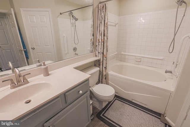 full bathroom featuring shower / tub combo, vanity, and toilet