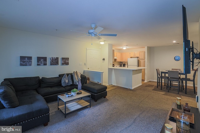 carpeted living room featuring ceiling fan