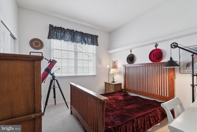 bedroom featuring light carpet