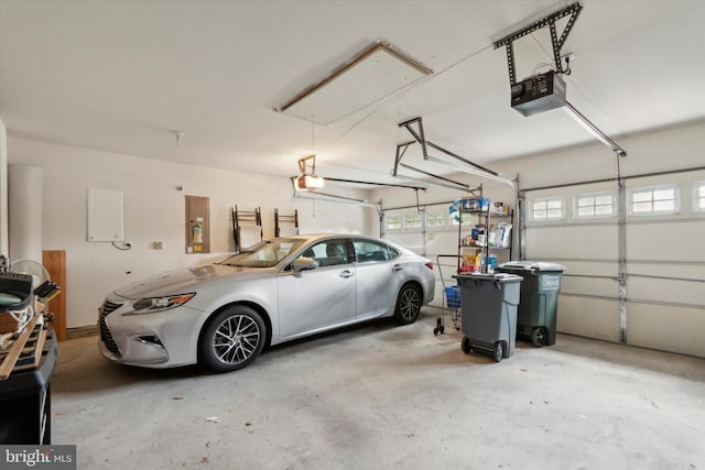 garage featuring a garage door opener and electric panel