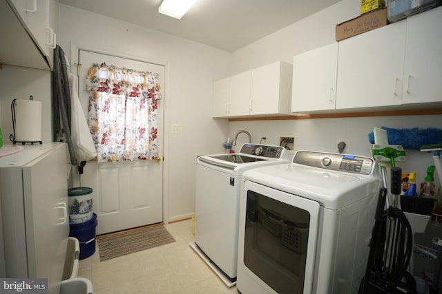 37978 George F Dr, Mechanicsville, MD 20659 - laundry area with cabinet space, light floors, and washer and clothes dryer
