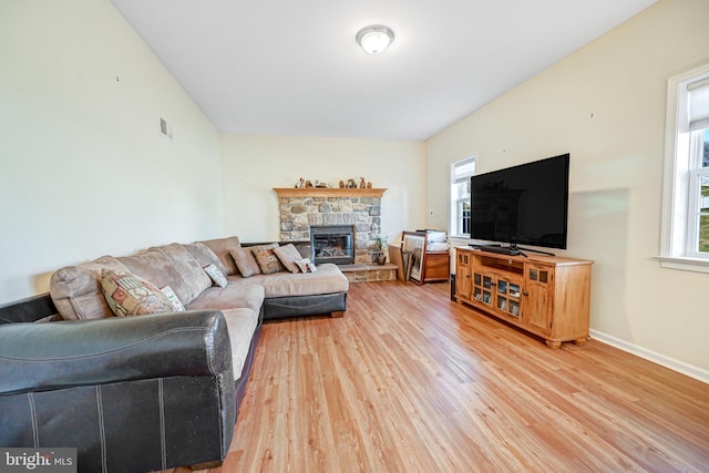 living room featuring a fireplace and hardwood / wood-style floors