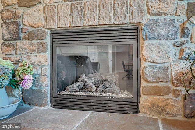 room details featuring a stone fireplace