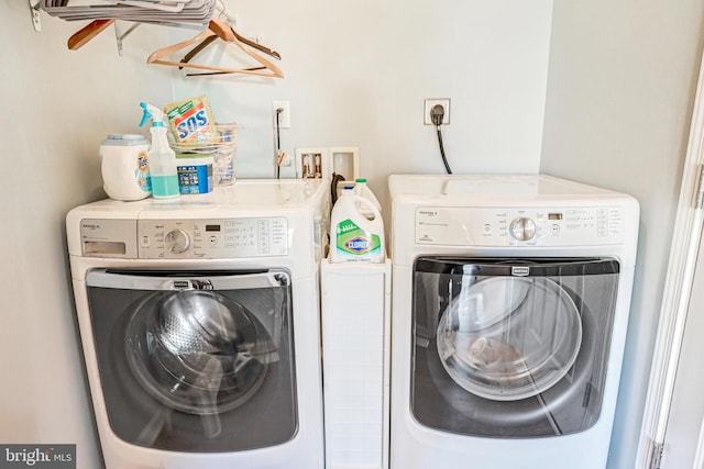 washroom with separate washer and dryer