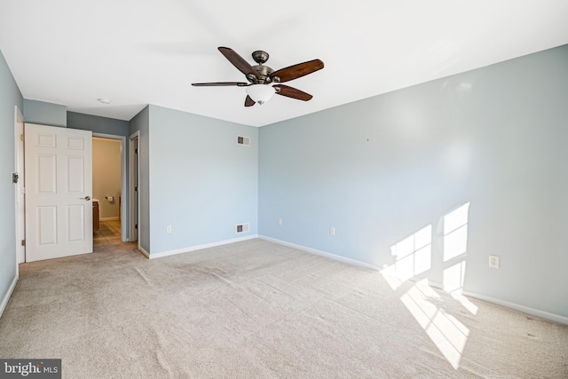 unfurnished bedroom featuring light carpet and ceiling fan