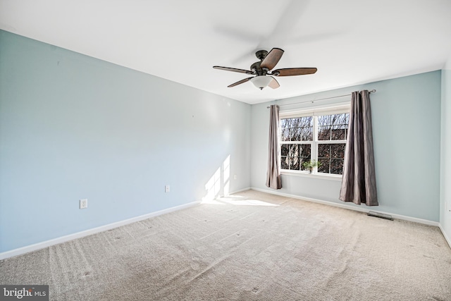 empty room with carpet flooring and ceiling fan