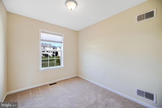 unfurnished room featuring carpet flooring