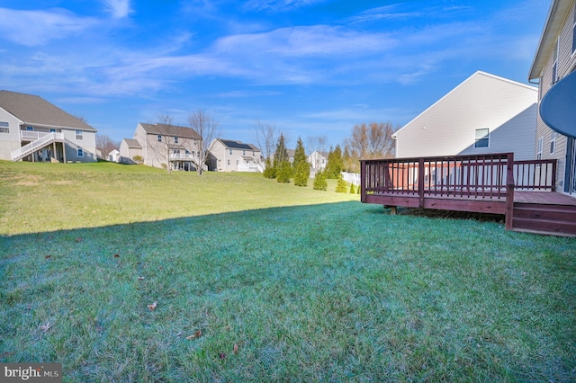 view of yard featuring a wooden deck