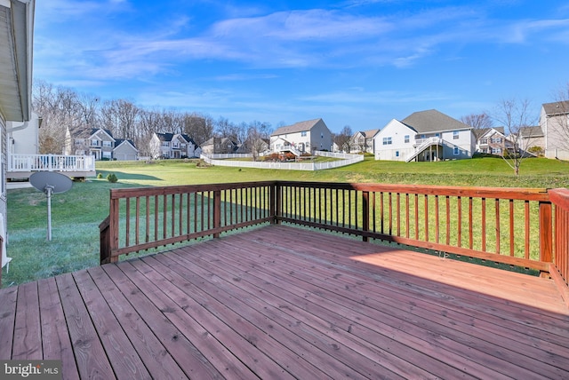 wooden terrace with a lawn