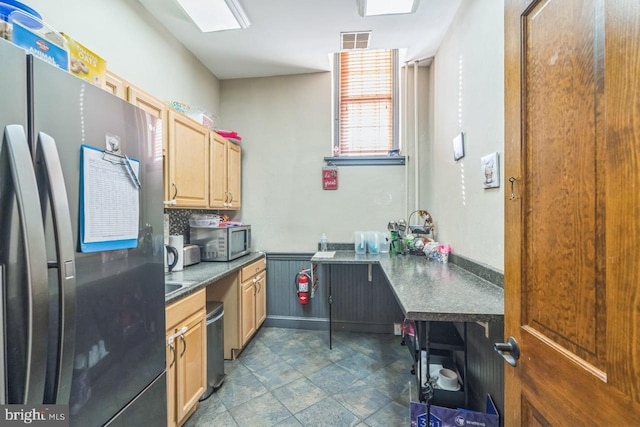 kitchen featuring tasteful backsplash and stainless steel appliances