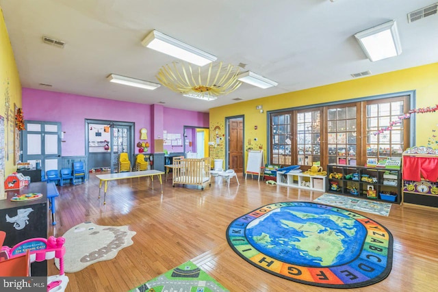 game room with wood-type flooring