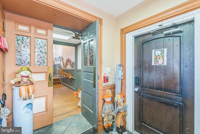 entryway with wood-type flooring