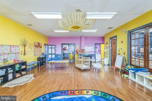 game room with hardwood / wood-style floors