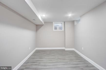 basement featuring light hardwood / wood-style floors